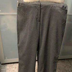Grey trousers with filigree detailing on sides